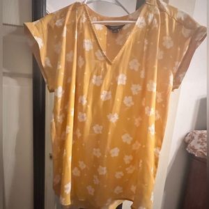 Dressy yellow flowered blouse. Worn once. Cute with jeans.